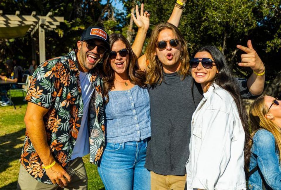 four people wearing sunglasses and smiling